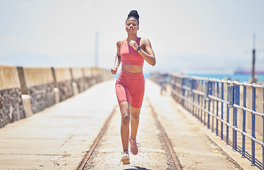 Image showing Black woman, running and fitness with runner outdoor, athlete with cardio and speed with run on bridge. Runner, active and sports with workout, exercise and training for marathon or race with mockup