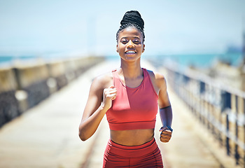 Image showing Black woman, fitness and running with smile for exercise, cardio workout or training in the outdoors. Happy African American female runner smiling in run, exercising or marathon for healthy lifestyle