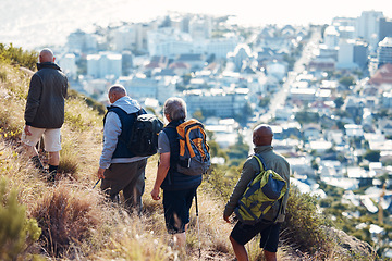 Image showing Hiking, city and senior friends on mountain for fitness, trekking and backpacking adventure. Explorer, discovery and expedition with men mountaineering in nature for health, retirement and journey