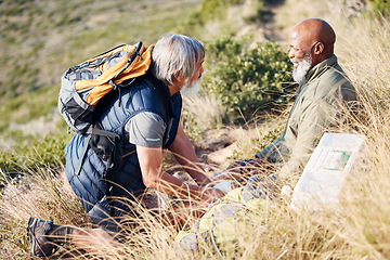 Image showing First aid, knee pain and hiking with senior friends in nature for trekking, adventure and fitness. Help, bandage and medical with old men and injury on trail for backpacking, discovery and emergency