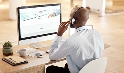 Image showing Black man, call center and computer for tech support, communication and crm help at desk in office. Telemarketing expert, contact us and pc at desk for customer service for consulting on voip tech