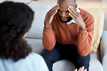 Image showing Black man, mental health and headache with psychologist, stress and depression with help. Psychology consultation, woman doctor with patient and conversation about anxiety problem, sad and depressed