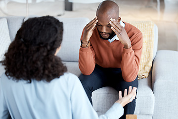 Image showing Black man, mental health and counseling with woman psychologist, stress headache and depression with help. Consultation, doctor with patient and conversation about anxiety problem, sad and depressed