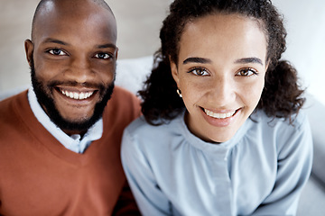 Image showing Happy, smile and portrait of an interracial couple on the sofa for happiness, relax and together. Love, care and above face of a black man and woman on living room couch in a marriage for relaxing