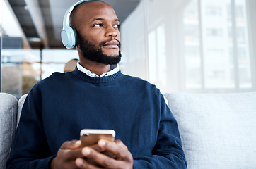 Image showing Black man thinking with smartphone, headphones and music for calm and peace, vision and mindset with audio streaming. Online, listening to radio or podcast for motivation, social media and mockup