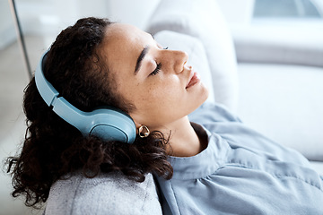 Image showing Face, woman and headphones for listening to music for calm, peace and mindfulness on home couch. Young person on living room sofa listen to podcast, audio or motivation to relax or meditation profile