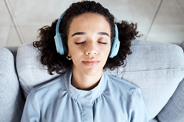 Image showing Woman, face and headphones for listening to music for calm, peace and mindfulness on home couch. Young person on living room sofa listen to podcast, audio or motivation to relax or meditation above