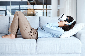 Image showing Virtual reality, metaverse and 3D gaming with a black woman on a sofa in the living room of her home. AI, VR and simulation with a female gamer using a headset to access cyberspace for a video game