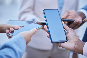 Image showing People, hands and phone in social networking with screen mockup for mobile app, advertising or marketing. Hand of group with smartphone for internet sharing, online collaboration or advertisement