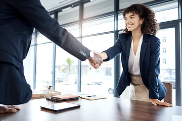 Image showing Business people, handshake and smile for b2b, interview or partnership in teamwork at the office. Happy female executive shaking hands with employee for meeting, greeting or introduction at workplace