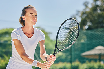 Image showing Senior woman, tennis player and ready in sports game for ball, match or hobby on the court. Happy elderly female in sport fitness holding racket smiling in stance for training or practice outdoors