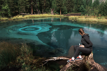 Image showing Woman at Beautiful Geyser lake