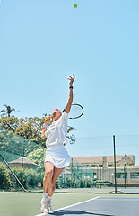 Image showing Tennis serve, sports and woman on outdoor court, fitness motivation and competition with athlete training for game. Workout, healthy and player on court, active with sport and exercise with action