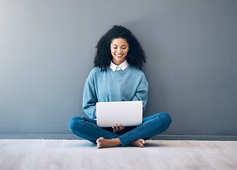 Image showing Laptop, smile and search with black woman on floor for social media, news and designer on wall mockup. Website, online shopping and technology with girl for communication, internet and digital