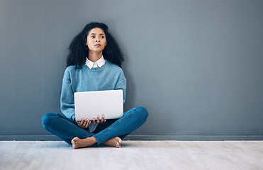 Image showing Laptop, relax and thinking with black woman on floor and wall mockup for social media, news or website. Design, online shopping and technology with girl for communication, internet or advertising