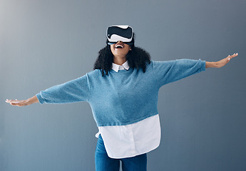 Image showing Headset, virtual reality and gaming woman in metaverse with hands for 3d fantasy gaming in studio. Happy gamer vr .glasses in digital world, futuristic game and ar or ux experience on grey background