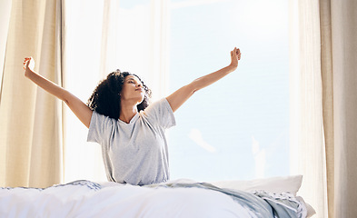 Image showing Black woman, morning stretching and wake up in home bedroom after sleeping or resting. Relax, peace and comfort of young female stretch after sleep feeling fresh, awake and well rested in house.