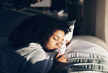 Image showing Black woman, sleeping in bed for peace, quiet and rest or relax in home bedroom. Person with pillow to dream or for calm sleep with sunlight for health and wellness in apartment or hotel