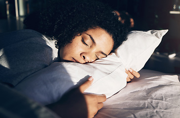 Image showing Black woman, sleeping and pillow in morning for peace, quiet and rest or relax in home bedroom. Person on bed to dream or for calm sleep with sleepy or stress relief for health and wellness