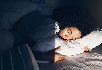 Image showing Black woman, bed and sleeping at night for peace, quiet and rest or relax in home bedroom. Person with pillow to dream, security or for calm sleep with nap or comfort with duvet for wellness