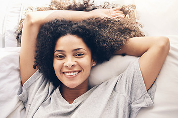 Image showing Black woman, top view and wake up portrait in bedroom after sleeping in the morning. Peace, bed relax and comfort of happy female awake after sleep on comfortable pillow and blankets for healthy rest