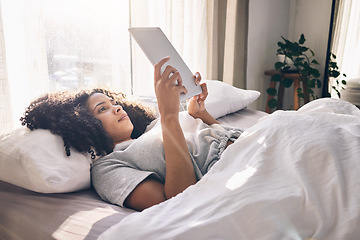 Image showing Relax, tablet and black woman in bed in bedroom for social media, texting or internet browsing in the morning. Technology, home and female with digital touchscreen for web scrolling after waking up.