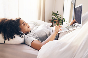 Image showing Music earphones, laptop and woman in bed in bedroom for social media or internet browsing in the morning. Technology, relax or black female with computer for streaming podcast, audio or radio in home