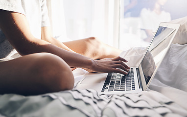 Image showing Laptop, hands and typing in bed in bedroom for social, media or internet browsing in the morning. Digital technology, remote worker and woman working on project, writing email or research on computer