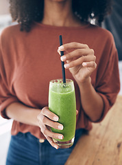 Image showing Hands, glass and smoothie with a black woman drinking a health beverage for a weight loss diet or nutrition. Wellness, glass and drink with a healthy female enjoying a fruit beverage at home