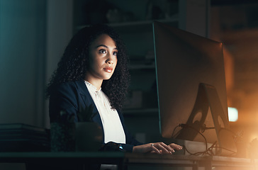 Image showing Night, office and black woman on computer for business project, management report and online document. Corporate worker, overtime and focused female working on strategy, planning and website research