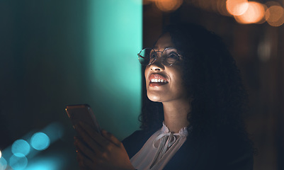 Image showing Business, black woman and phone at night thinking idea for communication network connection. Entrepreneur person in dark office for social media ux, networking or ai mobile app marketing mockup