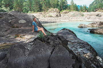 Image showing Woman resting at river