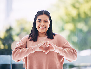 Image showing Portrait, heart hands and young woman for self care, cardiology wellness and gen z support for women health. Face of a happy Indian person with love emoji, sign or gesture for like, vote and peace