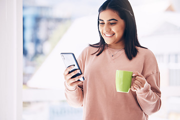 Image showing Woman, phone or drinking coffee in house, home or penthouse apartment on social media app, internet or dating website. Happy smile, student and relax tea cup, mobile blog or communication technology