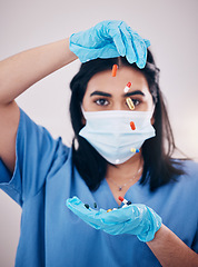 Image showing Woman, doctor and hands with face mask and pills for healthcare or antibiotics against a studio background. Female medical nurse expert with latex gloves, tablets or prescription medication for pain