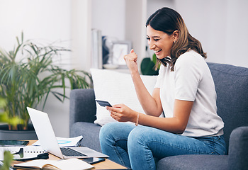 Image showing Success, laptop or winner excited with credit card or digital payment in celebration on sofa at home. Yes, finance or happy girl celebrates online shopping subscription discount, sales offer or deal