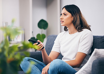 Image showing Woman confused, watching tv and remote control, relax at home and squint with vision problem and streaming movie. Thinking, entertainment and confusing television show with young person in lounge