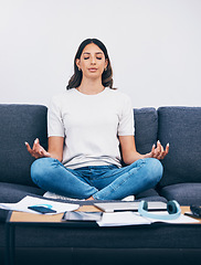 Image showing Zen, meditation and Indian woman in a living room with yoga to relax from book learning. Sofa, home and female student meditate on a couch doing wellness exercise in a house with education notebook