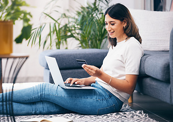 Image showing Credit card, online shopping and woman on laptop, banking and fintech for easy payment on home carpet. Young person or student with computer for e commerce sale, finance and wealth in her living room