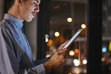 Image showing Businessman, night and office with tablet in hands for research, market analysis and communication at job. Man, mobile touchscreen ux and reading for data analytics, progress and growth of company