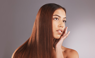 Image showing Woman, long hair and face for skincare, facial or beauty cosmetics against a gray studio background. Attractive female touching skin in self love or haircare for cosmetic keratin treatment on mockup