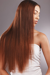 Image showing Black woman with straight brown hair isolated on studio background for healthy glow, beauty shine or care. Young USA model or person for natural growth, red dye color and salon hairdresser treatment