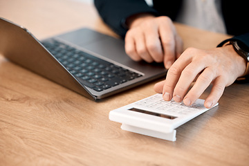 Image showing Hands, laptop and calculator for finance, audit or statistics at office desk in costs, expenses or bills. Hand of financial advisor, accountant or person calculating profit in corporate management