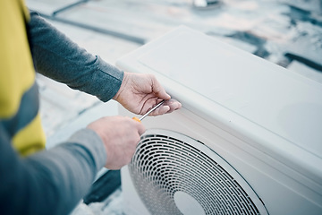 Image showing Hands, air conditioner and maintenance with a man construction worker on a rooftop to install a cooling system. Engineer, hvac and ac repair with a male handyman servicing a building closeup