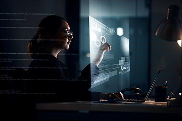 Image showing Futuristic, hologram and laptop with business woman at night for software, augmented reality and digital transformation. Developer, 3d and overlay with employee for technology and cloud computing
