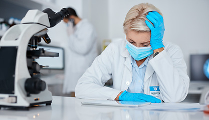 Image showing Senior woman, covid mask and tablet research feeling stress and anxiety about online results. Wellness, healthcare laboratory and medical employee doing pharmaceutical data working in a clinic lab