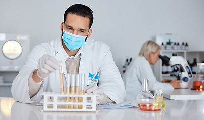 Image showing Scientist man, test tube and laboratory for covid 19 research for goal with mask at pharma company. Science team, data analytics and biotech with ppe, vision and medical study with microscope in lab