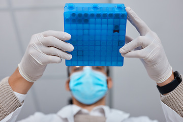 Image showing Science, research and hands with a liquid container for medical innovation and vaccine analysis. Healthcare, lab and scientist holding vials for a dna test, pharmaceutical investigation and exam