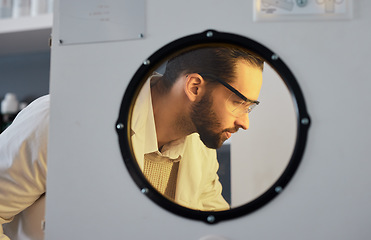 Image showing Scientist, man with incubator and science experiment with medical research, biotechnology or ivf with innovation. Scientific study in laboratory, test sample storage and doctor face with researcher