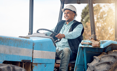 Image showing Tractor, man and farmer on field for agriculture, countryside or sustainability in nature. Happy farming worker driving machine truck, transport and sustainable ecology with happiness of land harvest